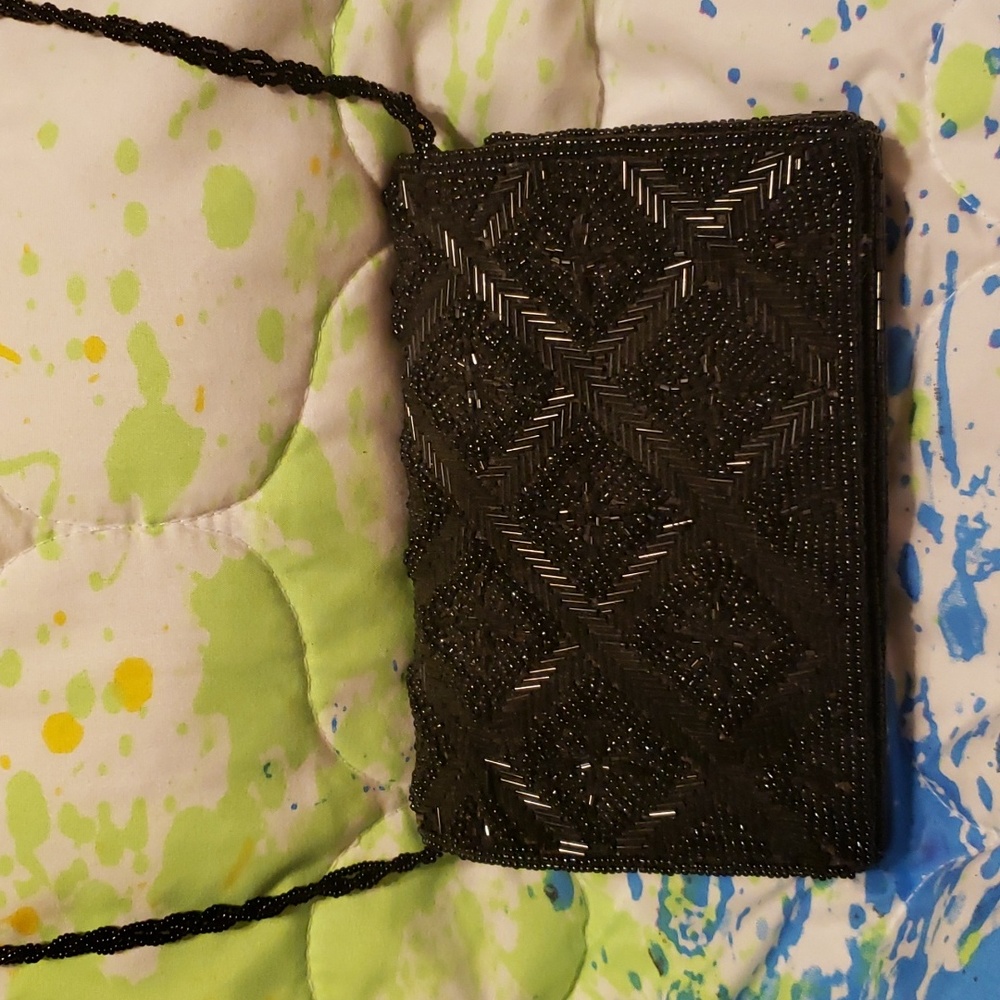 Black beaded evening purse magnetic closure and beaded strap. Perfect, no flaws.